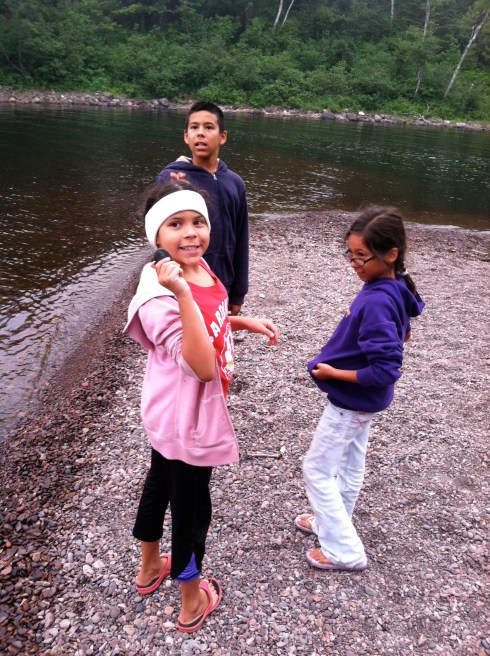 Cherry Pie shows the perfect skipping rock she has found.