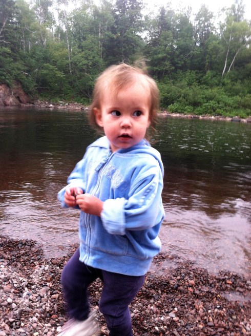 Baby Dumpling tries out rock throwing.